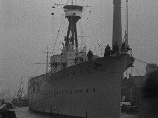 HMS Caroline Comes Into Dock